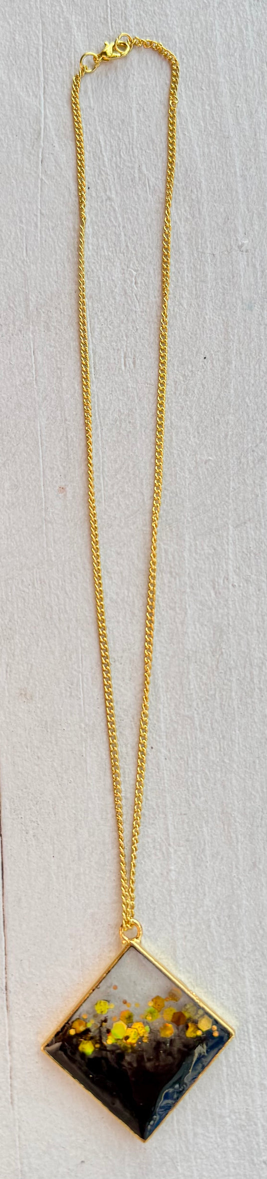 Gold Plated 18 inch Cable Link Chain Necklace with Black and Gold RESIN charm.